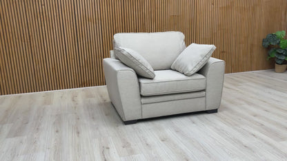 video showcasing the 'Chalfont' armchair in a modern living room environment.