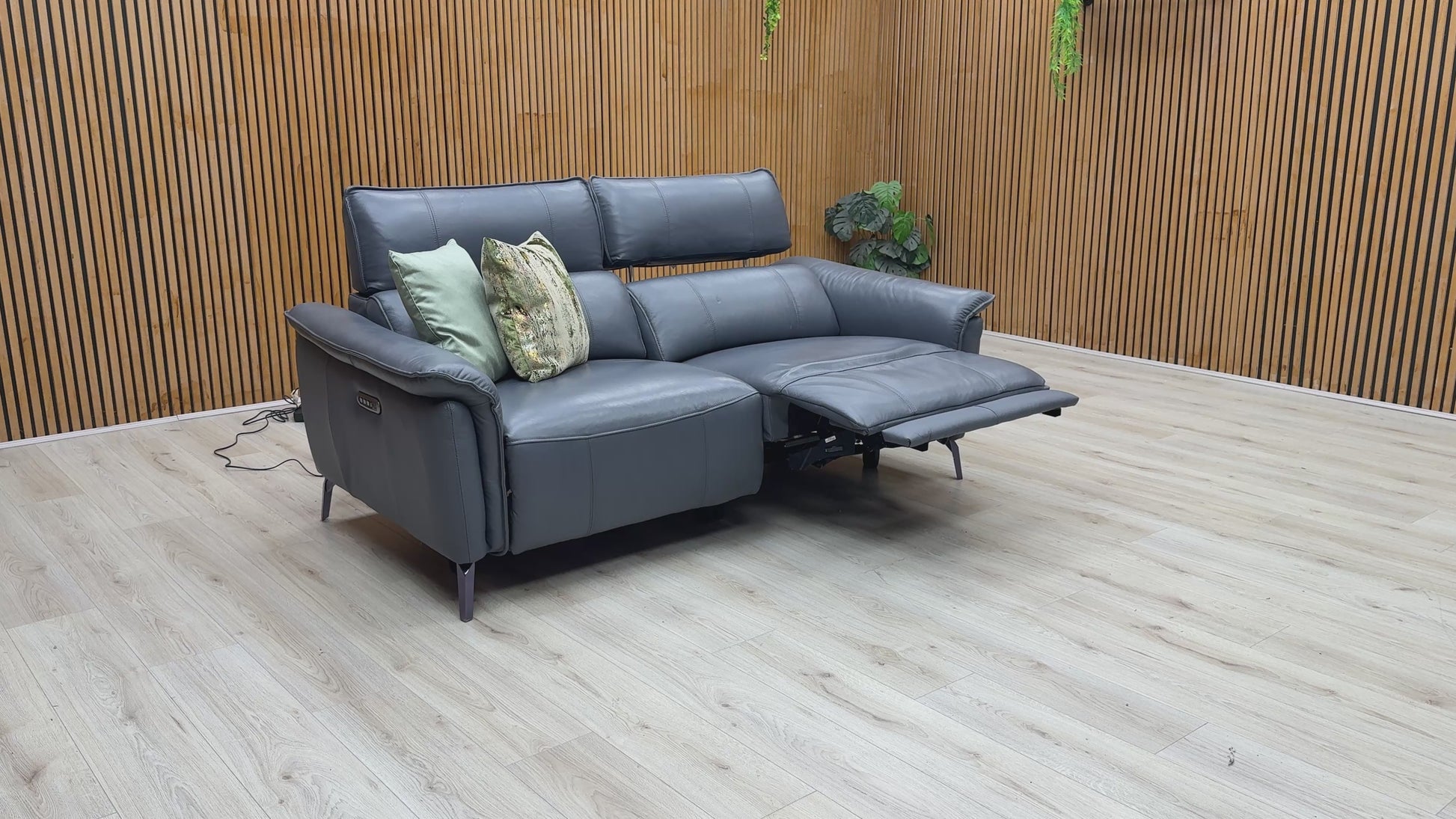Video of Furniture Village ‘Jude’ luxury 3-seater power recliner sofa, meticulously tailored in premium Montana lavender grey leather upholstery.