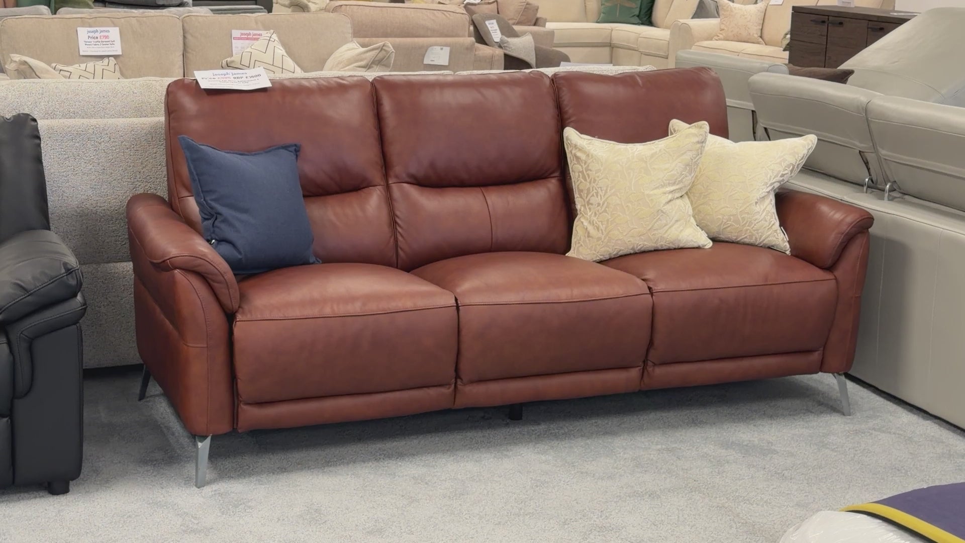 Product walk-around of the Daytona Butterscotch Leather 3-Seater, demonstrating the manual adjustable headrest mechanism and leather quality.