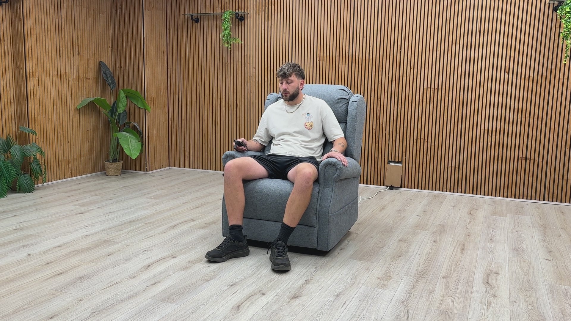 Video Of ‘Edin’ contemporary electric mobility armchair, beautifully upholstered in a durable, soft Grey fabric with an ergonomic high-back design.