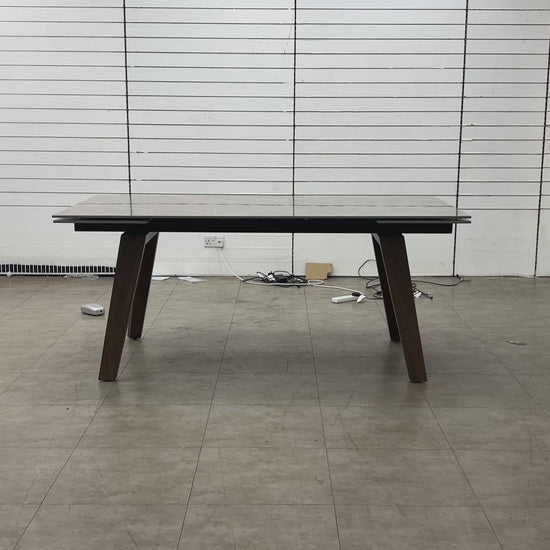 The Pierre dining table in its closed position, showcasing a compact profile ideal for everyday use.