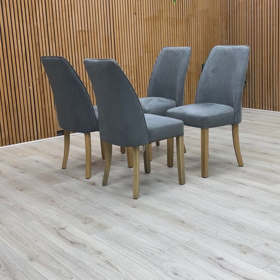 Video showing Set of 4 Hamilton Charcoal Grey Fabric Dining Chairs with contemporary upholstered design and wooden legs.