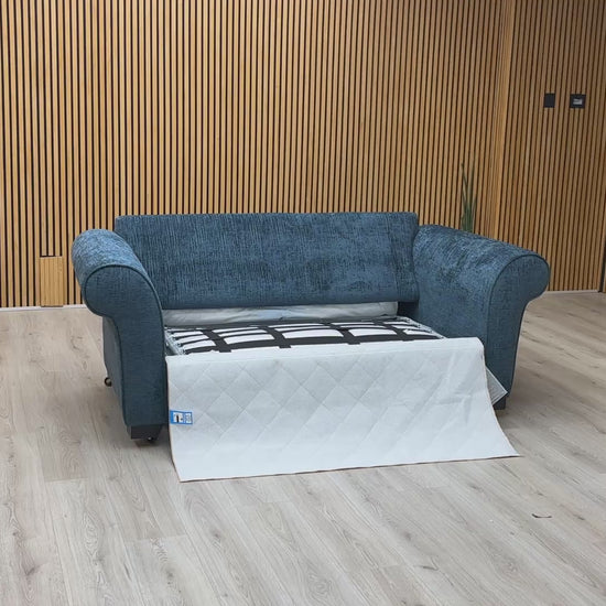 Product video tour of the ‘Hedingham’ Neptune Blue Bromley Chenille 2-Seater Sofa Bed, demonstrating the smooth transition from sofa to bed and the mattress quality.