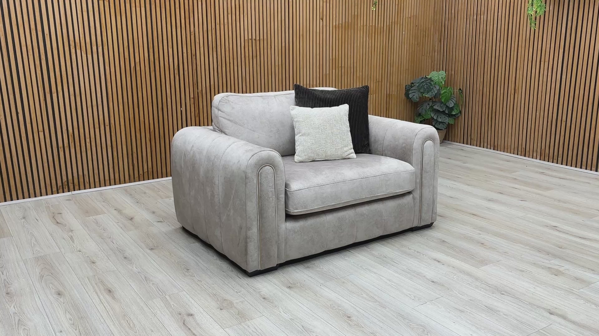Product walkthrough video demonstrating the snuggle chair's impressive size, cushion resilience, and soft fabric texture, highlighting its cozy seating area.