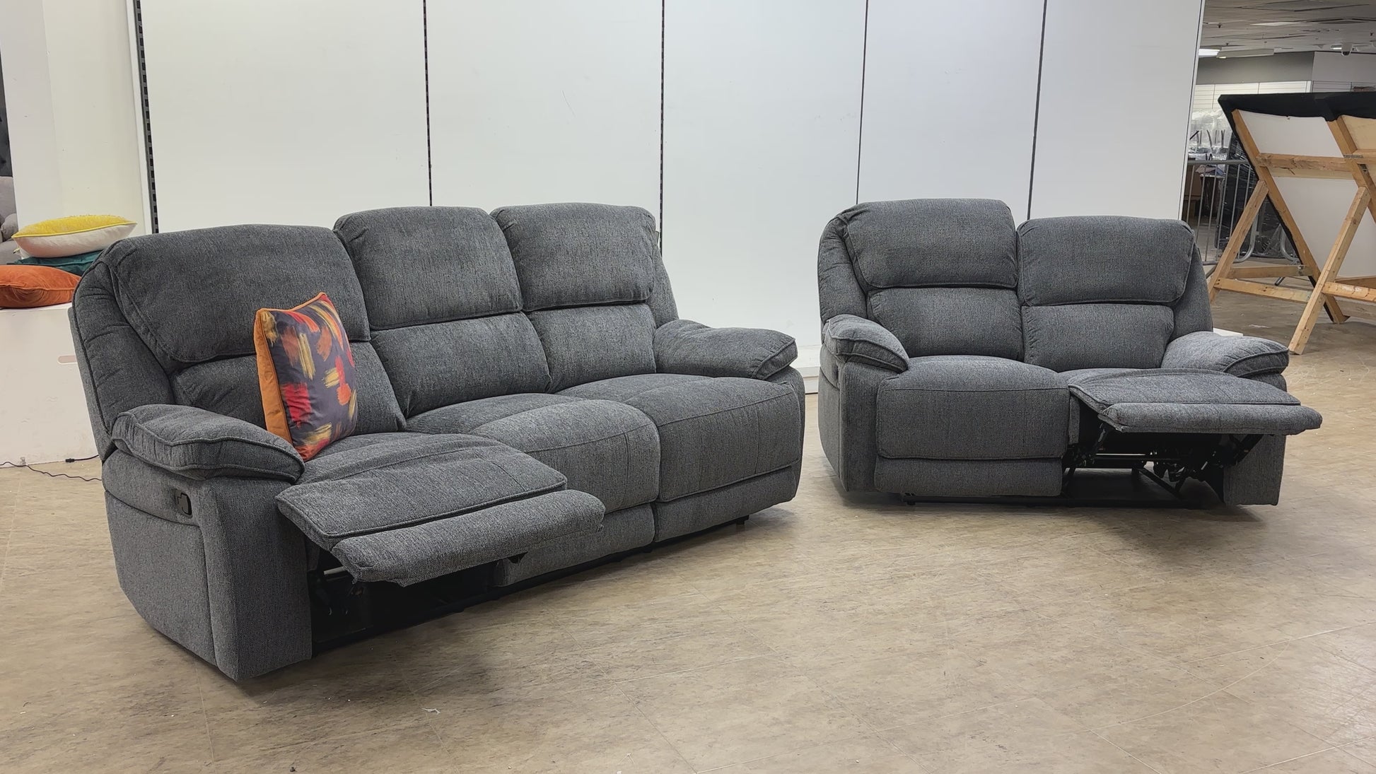 Product walkthrough video showing the reclining features and storage console of the Costa sofa set.