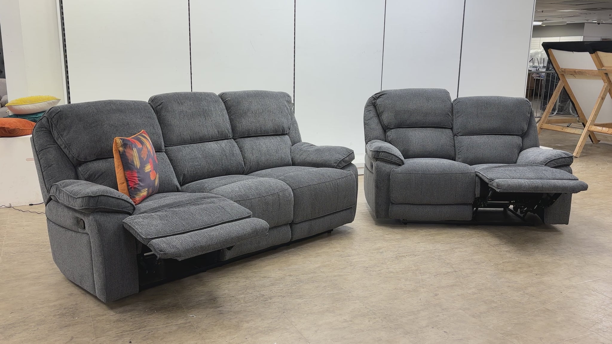 Product walkthrough video showing the reclining features and storage console of the Costa sofa set.