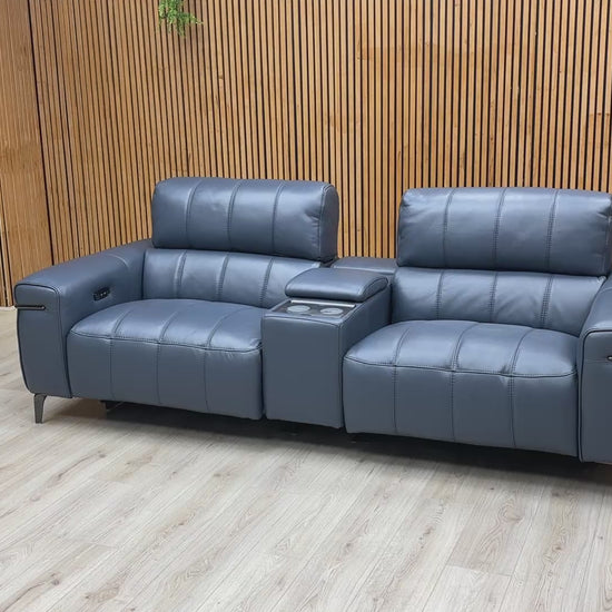 Video preview demonstrating the power recliner, power headrest, and media console features of the 'Homestage' sofa.