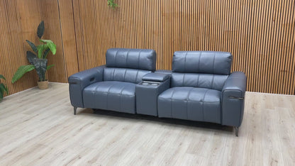 Video preview demonstrating the power recliner, power headrest, and media console features of the 'Homestage' sofa.