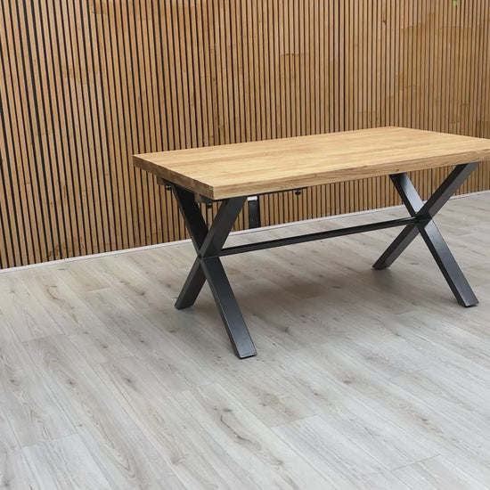 A video of the Earth dining table, panning across the wire-brushed oak surface and metal base.