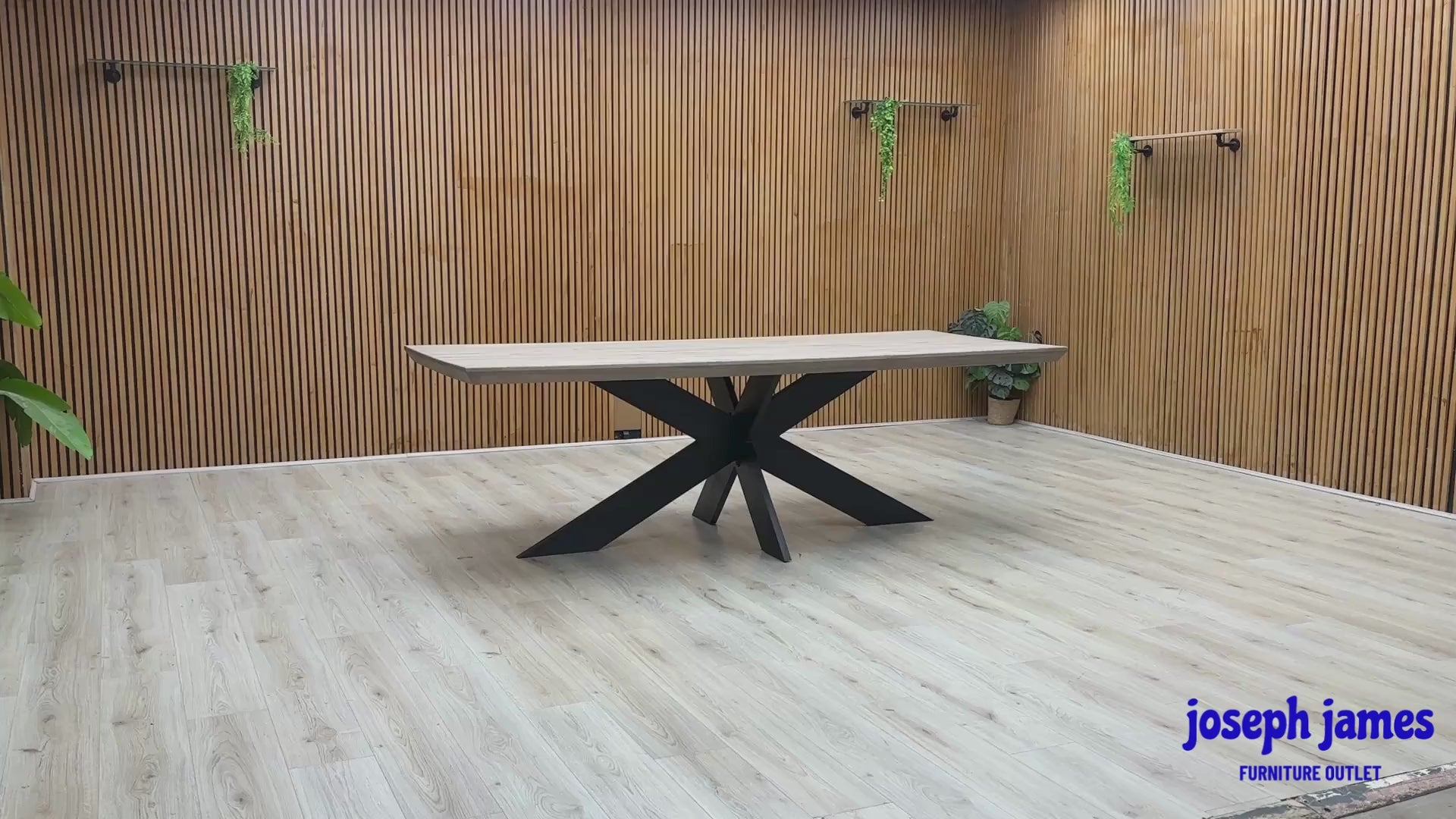 Video Of ‘Bodahl Terra’ industrial 240cm dining table, featuring an organic live-edge solid oak tabletop in a sophisticated Vintage Grey finish, supported by a striking architectural metal star base.