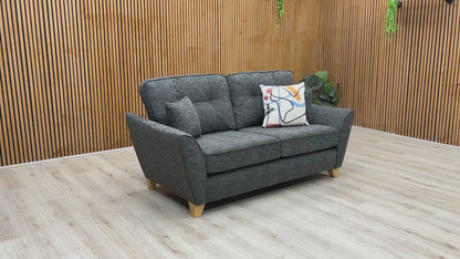 Product video tour of the ‘Halstow’ Charcoal Fabric 2-Seater Sofa, demonstrating cushion bounce-back resilience, fabric durability, and overall frame stability.