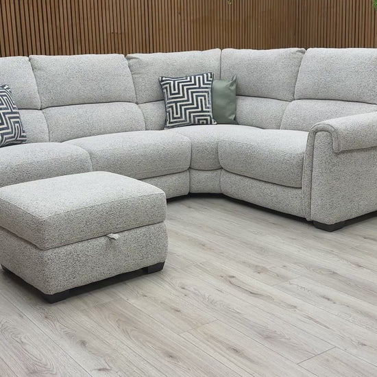 Product video tour of the ‘Nixon’ Oyster Fabric Corner Sofa, demonstrating the fabric’s durability, the seat comfort, and the storage capacity of the footstool.