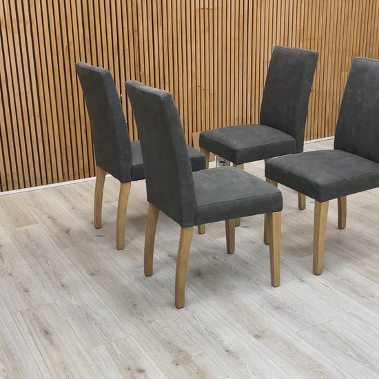 Product walkthrough video showcasing the Augusta dining chair's grey nubuck-look upholstery and sturdy rubberwood frame.