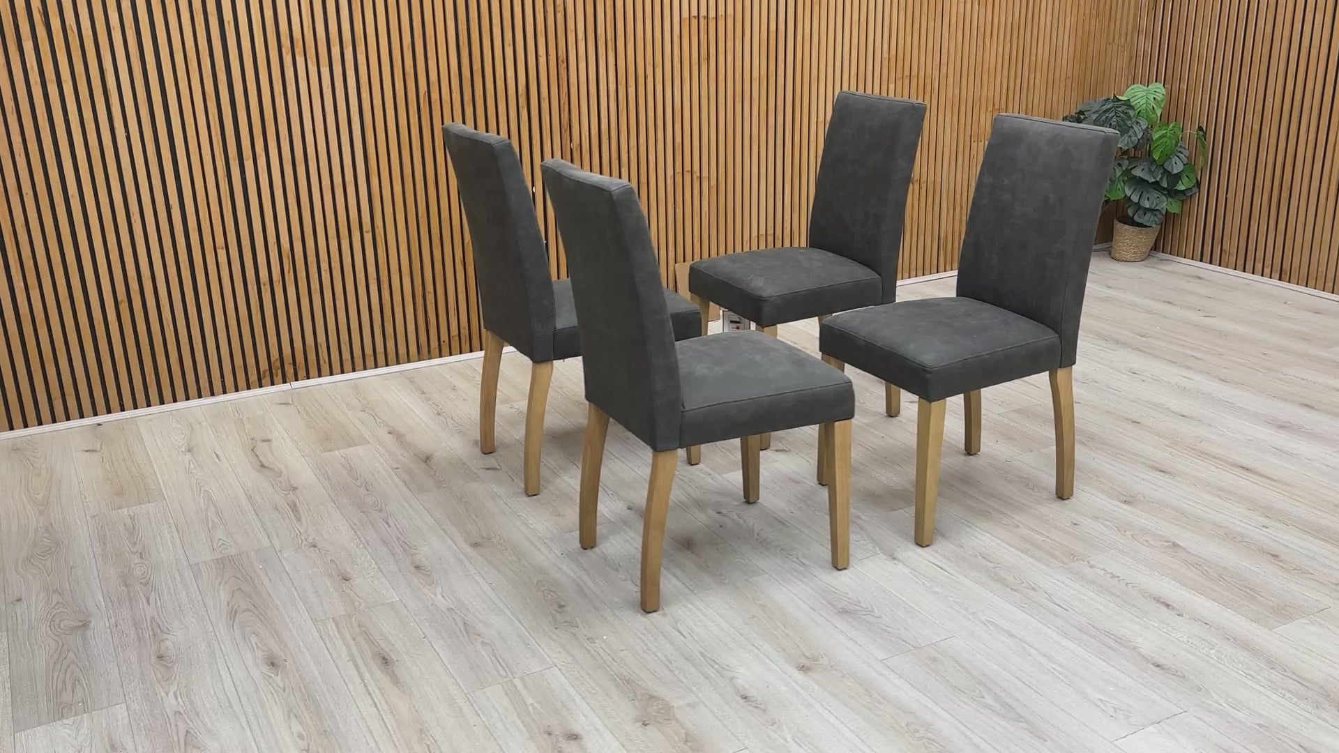 Product walkthrough video showcasing the Augusta dining chair's grey nubuck-look upholstery and sturdy rubberwood frame.