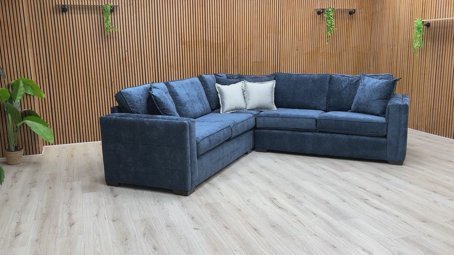 Video tour showing the 'Chelsea' navy sofa, demonstrating the soft feel of the fabric and the bounce-back of the foam cushions.
