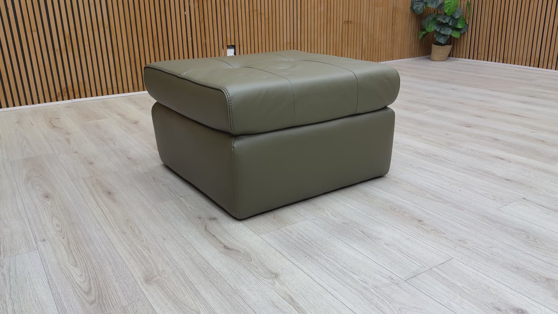 Video showcasing the construction, material, and full view of the 'Ava' Khaki Green Leather Large Square Footstool.