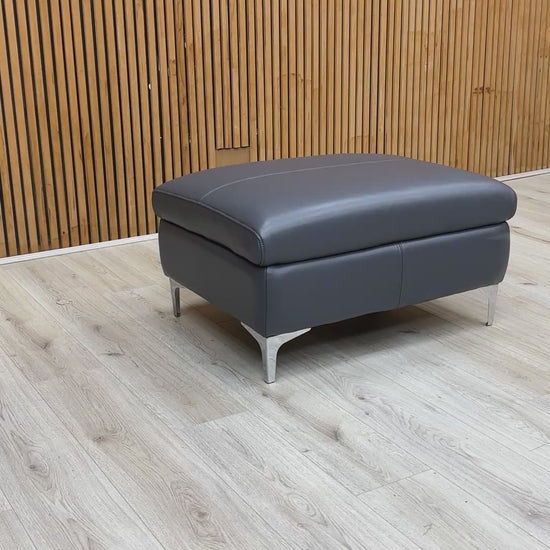 Product video tour of the ‘Vino’ Lavender Grey Leather Footstool, demonstrating the leather's supple feel and the sturdiness of the build.