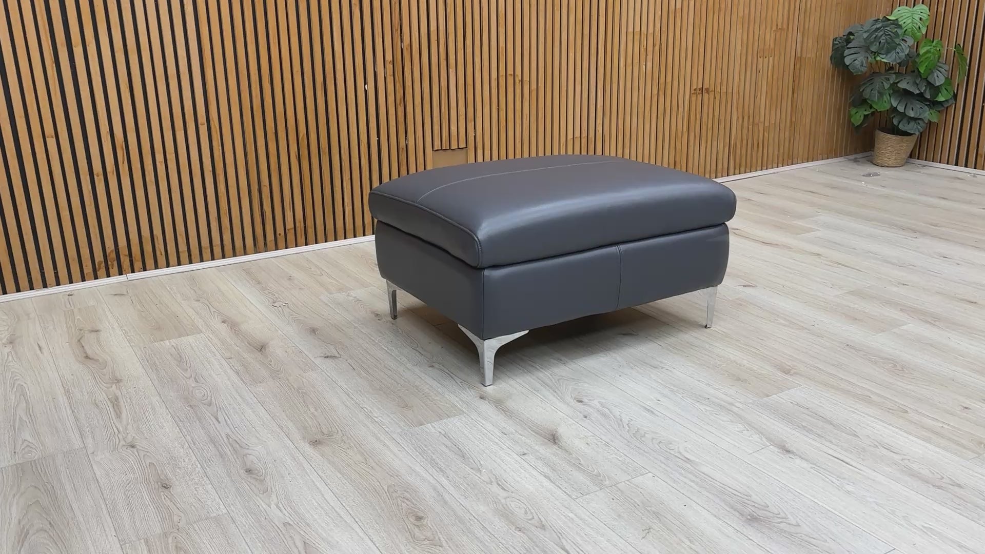 Product video tour of the ‘Vino’ Lavender Grey Leather Footstool, demonstrating the leather's supple feel and the sturdiness of the build.