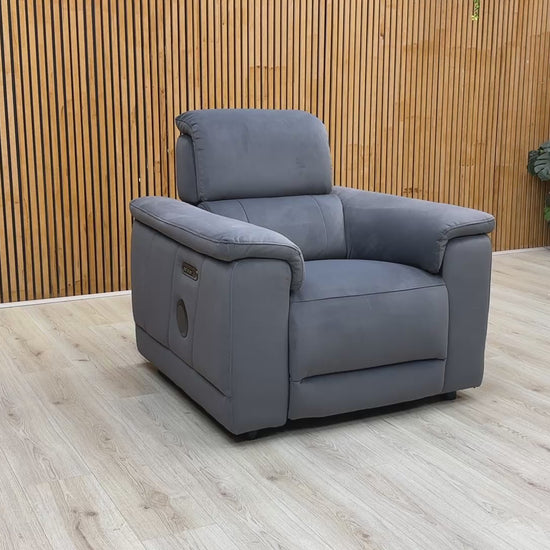 Product video tour of the ‘Genius’ Bella Iron Grey Power Recliner, demonstrating the smooth reclining action, adjustable power headrest, and Bluetooth audio connectivity.