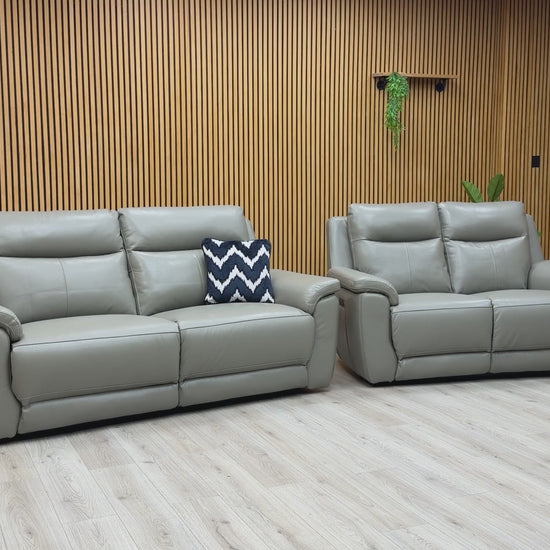 Product demonstration of the ‘Bobby Cat’ elephant grey leather set, showing the smooth motorized reclining action and independent headrest adjustment.