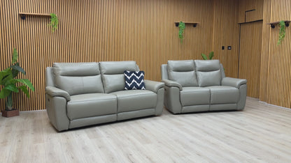 Product demonstration of the ‘Bobby Cat’ elephant grey leather set, showing the smooth motorized reclining action and independent headrest adjustment.