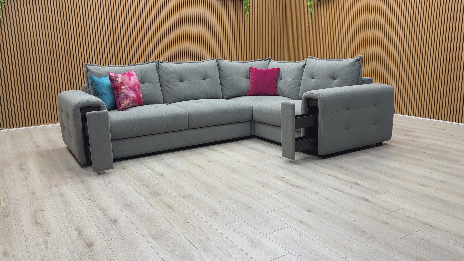 Video demonstrating the unique pull-out storage drawers hidden within the wide armrests of the Goliath sofa.