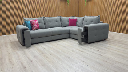 Video demonstrating the unique pull-out storage drawers hidden within the wide armrests of the Goliath sofa.