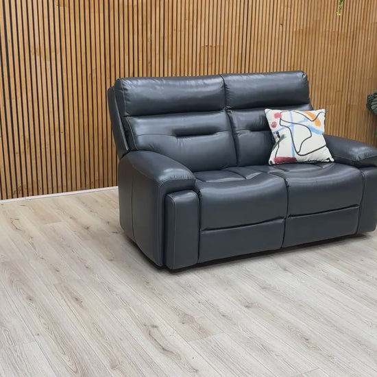 Product video tour of the ‘Cinemax’ Natural Milled Navy Leather 2 Seater Sofa, demonstrating the leather's natural grain, seat firmness, and overall build quality.