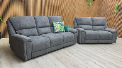 Video of the smooth electric power reclining function and USB charging port of the sofa set.
