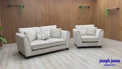 Video Of ‘Mariah’ luxury 2-seater sofa and matching armchair suite, beautifully upholstered in an elegant Dapple Ivory fabric and accented with sophisticated triple brass trim inserts.
