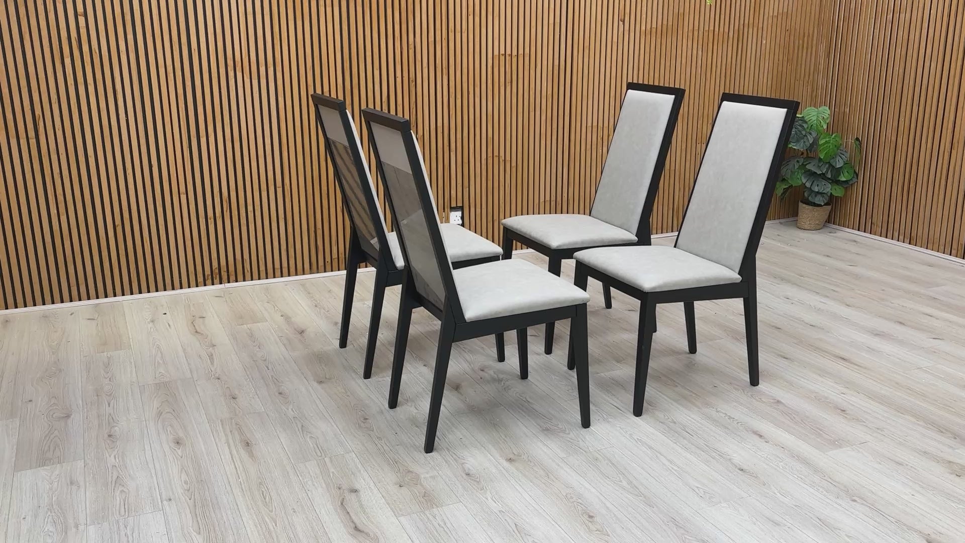 video showcasing the reflective high-gloss finish and the quality of the upholstered seat and back.