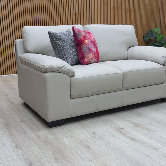 Video showing a detailed close-up of the light grey leather material on the 'Hofman' sofa.