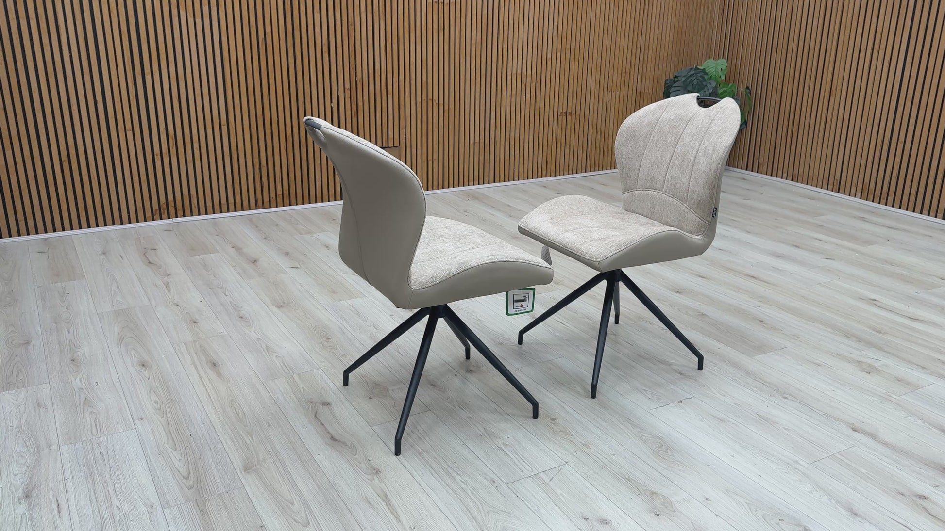 Video walkthrough showcasing the Raul pebble taupe fabric dining chairs, demonstrating the smooth auto-return swivel function, fabric texture under showroom lighting, and overall stability.