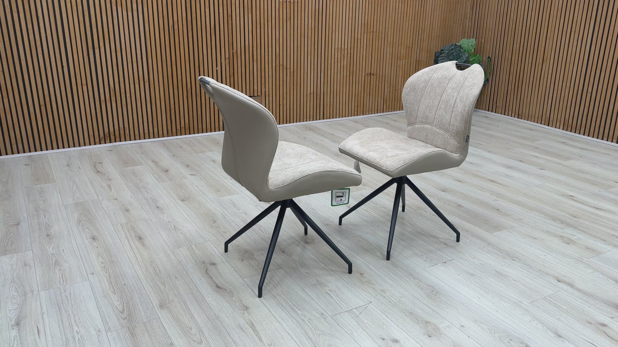 Video walkthrough showcasing the Raul pebble taupe fabric dining chairs, demonstrating the smooth auto-return swivel function, fabric texture under showroom lighting, and overall stability.