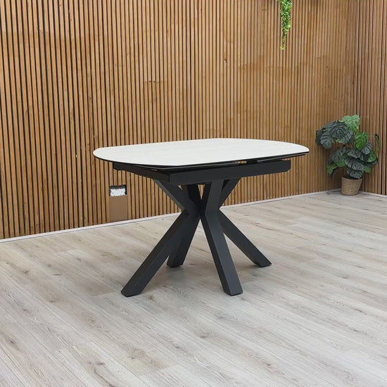 Product demonstration video showing the smooth 360-degree swivel mechanism used to extend the Raul dining table from a circle to an oval.