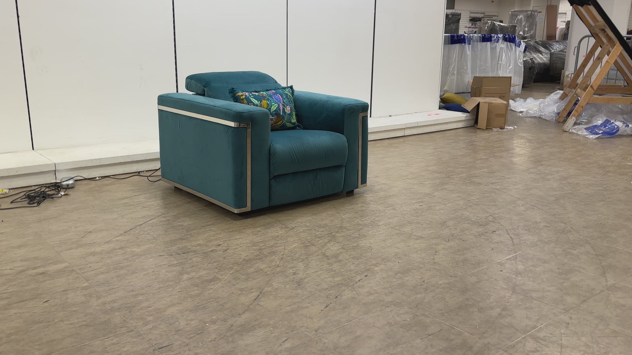 Video demonstrating the electric reclining function and adjustable power headrest of the 'Cora' teal velvet chair.