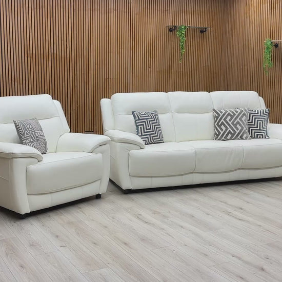 Video walkthrough showcasing the World of Leather Touch Star White leather 3-seater sofa and armchair, demonstrating leather resilience, cushion bounce-back, and frame stability.