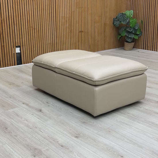Video Of Leather Storage Footstool with the lid slightly ajar, highlighting the practical storage design.