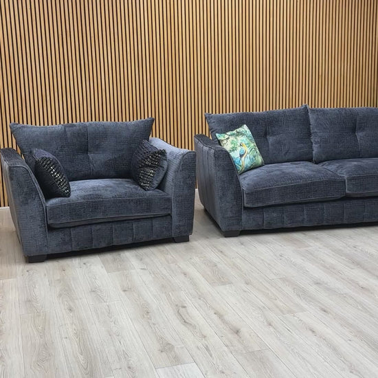 Product video tour of the ‘Allure’ Coco Indigo Sofa and Snuggler Set, demonstrating the fabric texture, seat comfort, and high-quality build.