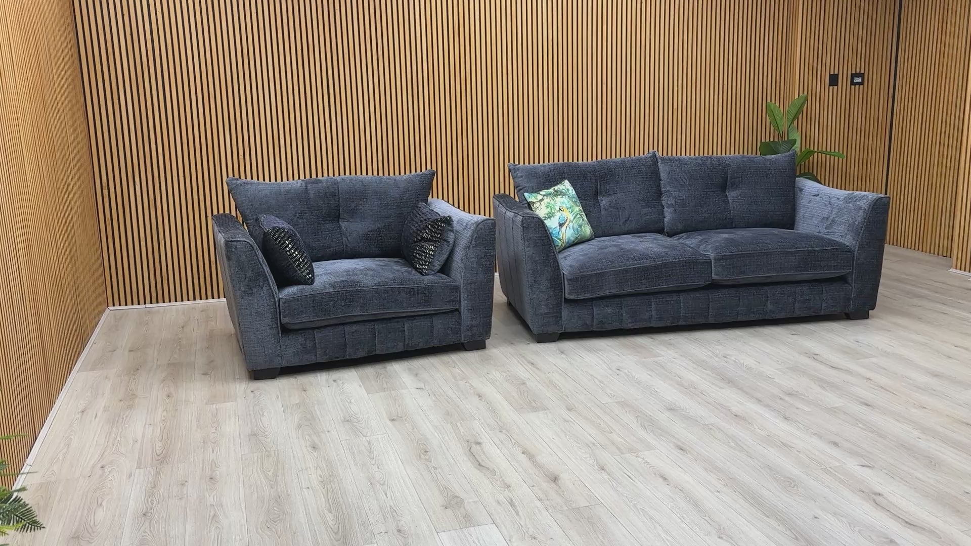 Product video tour of the ‘Allure’ Coco Indigo Sofa and Snuggler Set, demonstrating the fabric texture, seat comfort, and high-quality build.