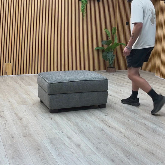 Video Of ‘Elora’ contemporary large storage footstool, beautifully upholstered in high-performance Kento 301 Warm Grey fabric with a neatly tailored lift-up top.