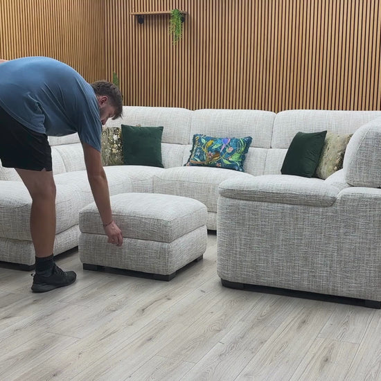 Video Of ‘Nova’ contemporary left-hand facing chaise end corner sofa, beautifully upholstered in a durable Fab MGA R04 Beige fabric and paired with a matching storage footstool.