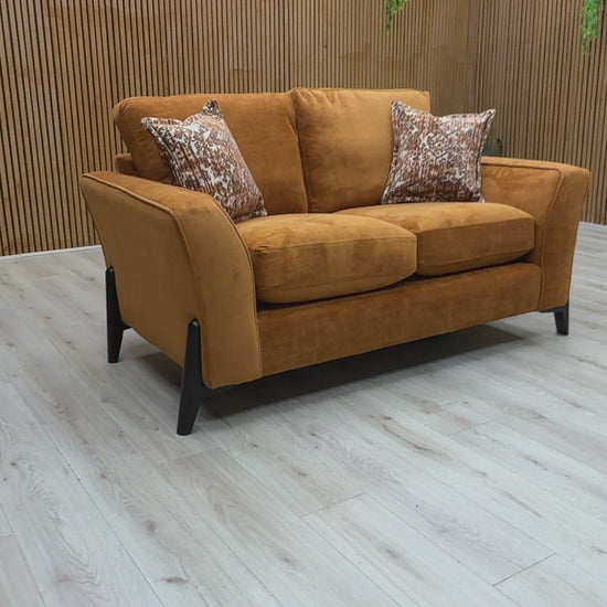 Video  for a clip demonstrating the features and solid almond orange color of the 'Collins' Towel Velvet 2 Seater Sofa.