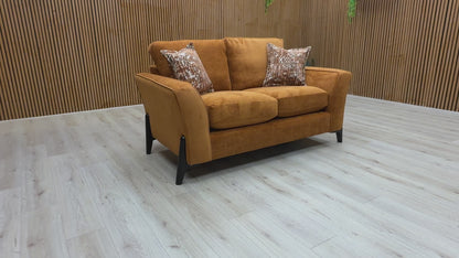 Video  for a clip demonstrating the features and solid almond orange color of the 'Collins' Towel Velvet 2 Seater Sofa.