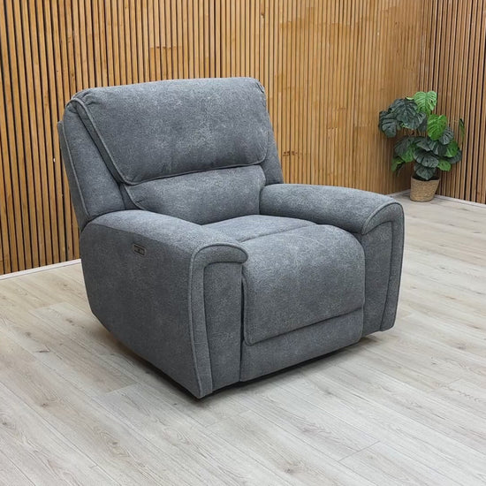 Product demonstration video showing the smooth power reclining action and headrest support of the Ricky chair.