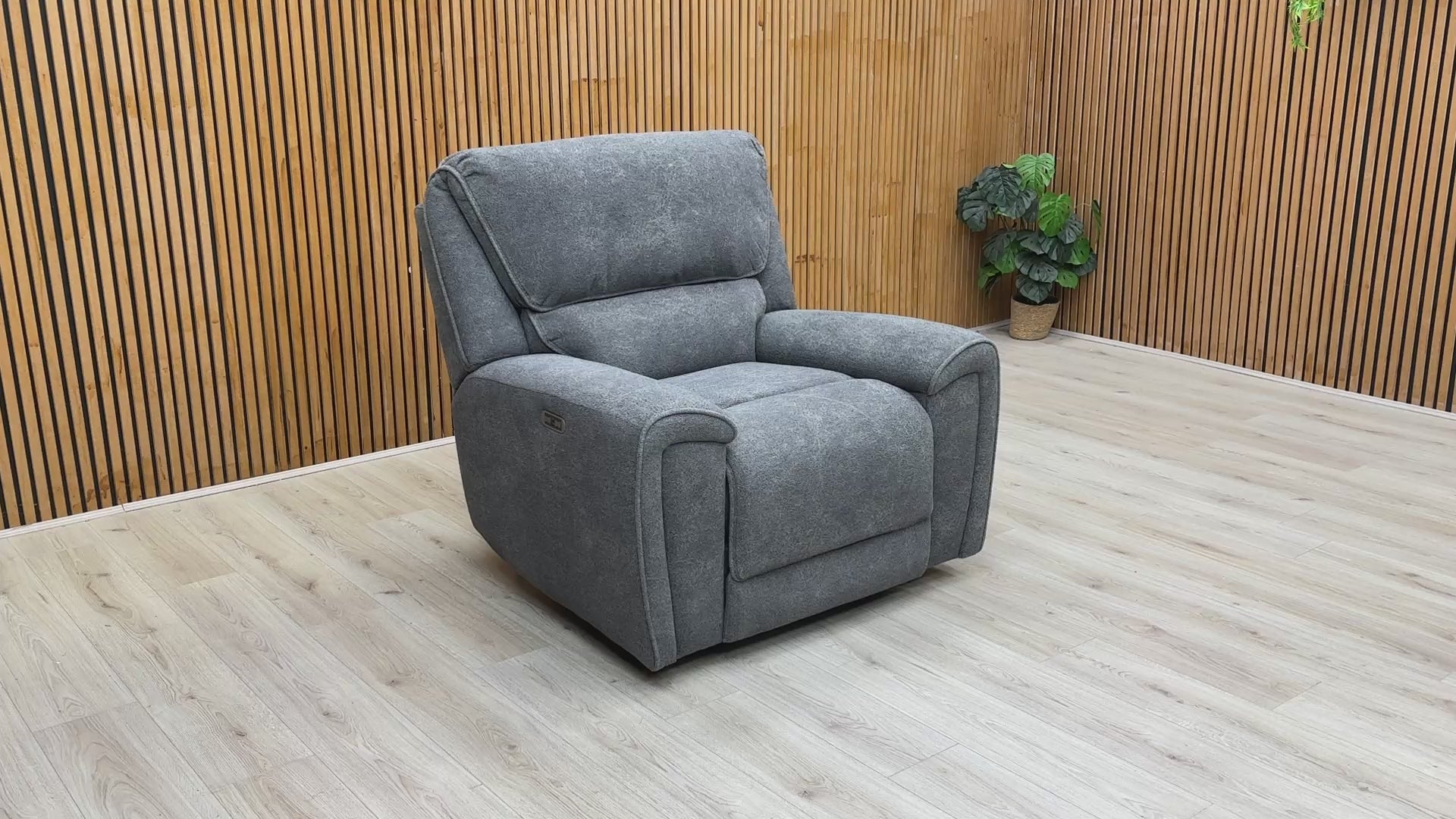 Product demonstration video showing the smooth power reclining action and headrest support of the Ricky chair.