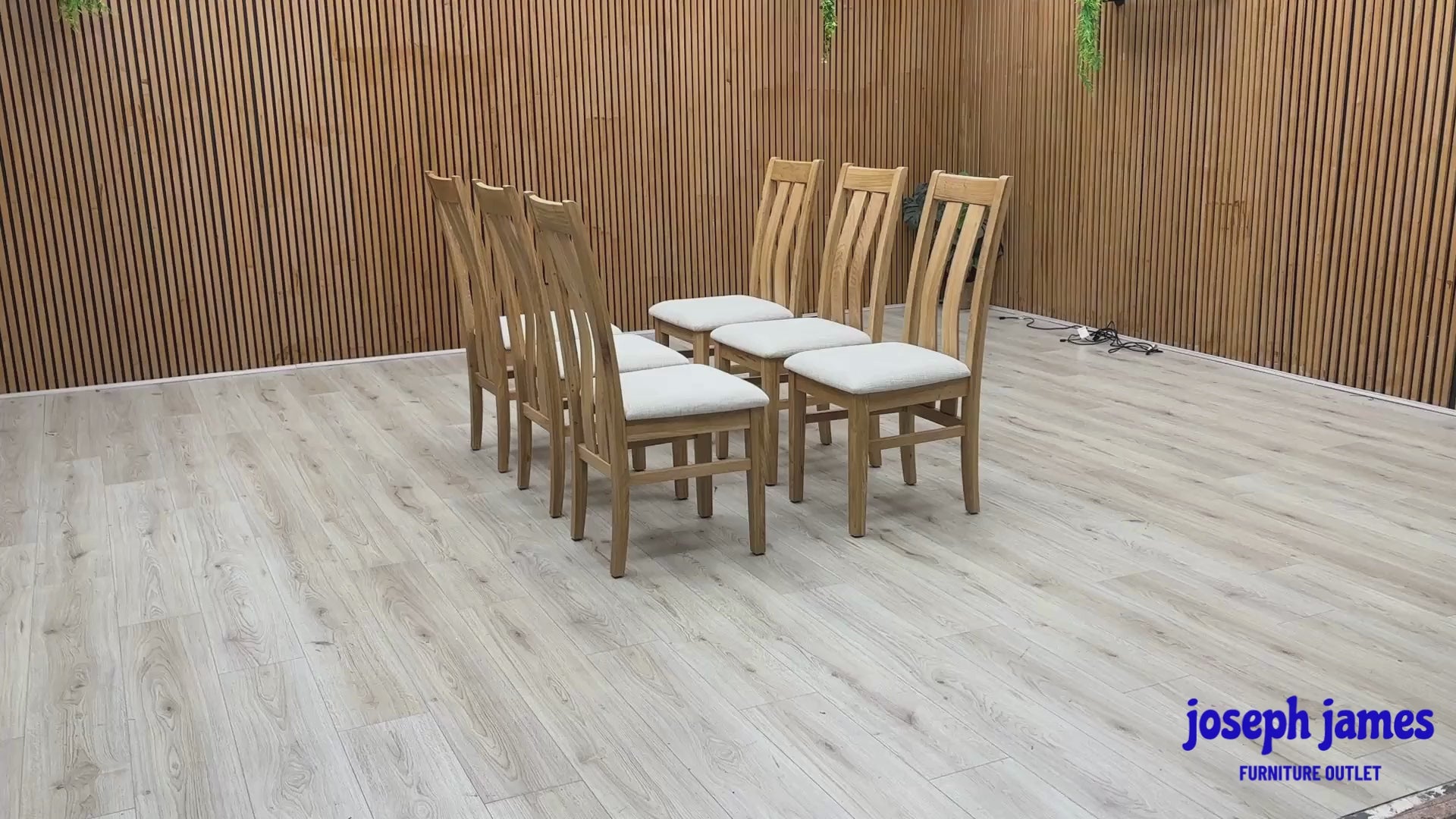 Video Of ‘Furnitureland Augusta’ contemporary dining chairs, showing a matching set of 6 individual chairs featuring an elegant wooden slatted-back design and padded seats upholstered in Clay fabric.