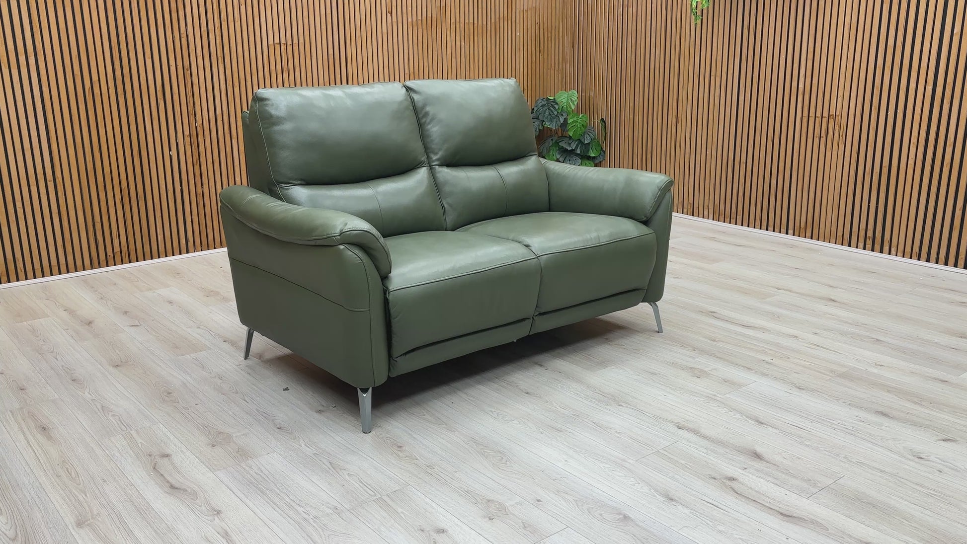 Video of smooth electric power reclining mechanism of the green leather 'Daytona' 2 Seater Sofa.