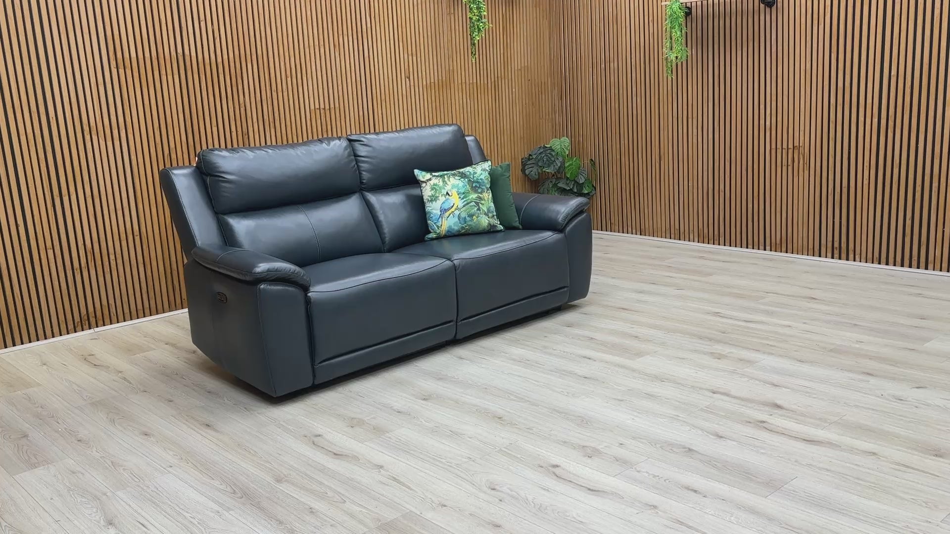 Video demonstration showing the Utah sofa's smooth power reclining mechanism and a close-up of the 100% real navy leather.