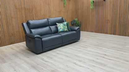 Video demonstration showing the Utah sofa's smooth power reclining mechanism and a close-up of the 100% real navy leather.